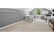 Bright bonus room featuring multiple desks and storage solutions at 8214 Lake Serene Dr, Orlando, FL 32836
