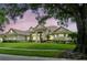 Stunning home with a landscaped lawn and elegant exterior design at 8214 Lake Serene Dr, Orlando, FL 32836