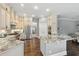 Open kitchen features granite countertops, custom cabinets, and stainless steel appliances at 8214 Lake Serene Dr, Orlando, FL 32836