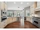 Bright and airy kitchen featuring custom cabinets, stainless appliances, and access to breakfast nook at 8214 Lake Serene Dr, Orlando, FL 32836