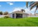 The home features a spacious backyard with lush green grass and a screened-in patio, perfect for outdoor activities and relaxation at 832 Seneca Trl, St Cloud, FL 34772