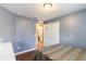 Cozy bedroom features wood floors, blue accent walls, and an ensuite bathroom at 832 Seneca Trl, St Cloud, FL 34772