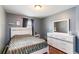 Calming bedroom features a cozy bed, dresser, and a soothing gray color scheme at 832 Seneca Trl, St Cloud, FL 34772
