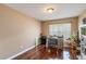 Bedroom with hardwood floors, a desk, and ample natural light from the window at 832 Seneca Trl, St Cloud, FL 34772