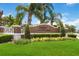 The community has a brick sign surrounded by beautiful landscaping, trees, and manicured lawns, creating an inviting atmosphere at 832 Seneca Trl, St Cloud, FL 34772