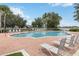Enjoy the community pool with lounge chairs and lush landscaping, perfect for relaxation and socializing with neighbors at 832 Seneca Trl, St Cloud, FL 34772