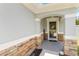 A welcoming front porch with stone accents and decorative welcome sign at 832 Seneca Trl, St Cloud, FL 34772