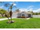 Charming single Gathering home with a well-manicured lawn, beautiful landscaping and a palm tree at 832 Seneca Trl, St Cloud, FL 34772