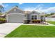 Charming single Gathering home with a well-manicured lawn and beautiful landscaping during daytime at 832 Seneca Trl, St Cloud, FL 34772