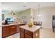 Bright kitchen featuring an island, stainless steel appliances, and an adjacent dining area at 832 Seneca Trl, St Cloud, FL 34772
