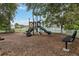 The community playground features a slide and climbing structure in a fenced-in area, providing a safe play area at 832 Seneca Trl, St Cloud, FL 34772