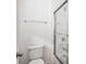 This bathroom features a shower with glass doors, toilet, and chrome hardware at 8359 Lookout Pointe Dr, Windermere, FL 34786