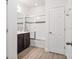 This bathroom features tile floors, double sinks and a glass door tub at 8359 Lookout Pointe Dr, Windermere, FL 34786