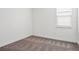 Neutral bedroom with carpeted floors, window, and base trim at 8359 Lookout Pointe Dr, Windermere, FL 34786