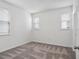 This bright bedroom has carpet flooring, a door and dual windows at 8359 Lookout Pointe Dr, Windermere, FL 34786