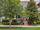 Beautiful two-story home featuring lush landscaping and a welcoming front porch, perfect for enjoying the outdoors at 8359 Lookout Pointe Dr, Windermere, FL 34786
