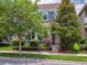 Charming two-story home with lush trees, a cozy front porch, and a well-maintained lawn at 8359 Lookout Pointe Dr, Windermere, FL 34786