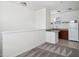 This loft includes carpet flooring, a railing and a kitchenette with granite counter at 8359 Lookout Pointe Dr, Windermere, FL 34786