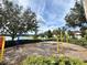 Playground with blue and yellow equipment at 8359 Lookout Pointe Dr, Windermere, FL 34786