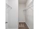 This walk-in closet has carpet flooring, and metal shelving to provide plenty of storage at 8359 Lookout Pointe Dr, Windermere, FL 34786