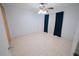 Bright, empty bedroom features tile floors, neutral colors, and good natural light at 956 Florida Pkwy, Kissimmee, FL 34743