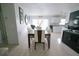 Comfortable dining area featuring a large table with seating for eight, next to the kitchen at 956 Florida Pkwy, Kissimmee, FL 34743