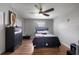 Bedroom featuring hardwood floors, closet, ceiling fan, and neutral paint at 1 Coyer Rd, Haines City, FL 33844