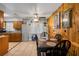 Cozy dining area featuring wood paneling and a traditional dining table setup at 1 Coyer Rd, Haines City, FL 33844