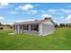 Well-maintained home with a spacious lawn, showcasing a clean exterior and tidy landscaping at 1 Coyer Rd, Haines City, FL 33844