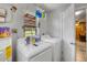 Laundry room features washer, dryer, and view of greenery outside at 1 Coyer Rd, Haines City, FL 33844
