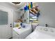 Laundry room features washer, dryer, and storage racks at 1 Coyer Rd, Haines City, FL 33844