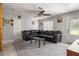 Inviting living room featuring a large sectional sofa and neutral decor for a relaxed vibe at 1 Coyer Rd, Haines City, FL 33844