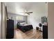 Serene bedroom with hardwood floors, a comfortable bed, and minimalist decor at 1 Coyer Rd, Haines City, FL 33844