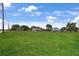 Spacious property for sale featuring a large grass-covered lot at 1 Coyer Rd, Haines City, FL 33844