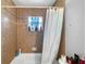 Bathroom with a shower and tub combination at 1 Coyer Rd, Haines City, FL 33844
