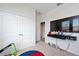 bedroom featuring closet space, a mounted TV and colorful toys at 11051 Bostwick Aly, Winter Garden, FL 34787
