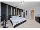 Bedroom featuring a black accent wall with gold inlays and exercise equipment at 11051 Bostwick Aly, Winter Garden, FL 34787