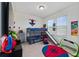 Playful room featuring bunk beds, a slide, and colorful decor at 11051 Bostwick Aly, Winter Garden, FL 34787