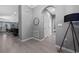 Open hallway with tile flooring leading to the main living areas, with a neutral color scheme at 11051 Bostwick Aly, Winter Garden, FL 34787