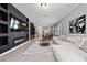 Spacious living room with a large sectional couch, modern decor, and an electric fireplace at 11051 Bostwick Aly, Winter Garden, FL 34787