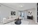 Comfortable living room with a sectional sofa, stylish decor, and sliding glass doors at 11051 Bostwick Aly, Winter Garden, FL 34787