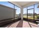 Screened in patio with brick flooring and an outdoor fan at 11051 Bostwick Aly, Winter Garden, FL 34787