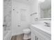 Modern bathroom with marble tile, new vanity, stainless steel fixtures, and updated shower at 113 W Division St, Winter Garden, FL 34787