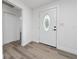 Bright entry with new vinyl flooring, a decorative glass door and freshly painted walls at 113 W Division St, Winter Garden, FL 34787