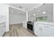 Renovated kitchen features stainless steel appliances and modern cabinetry at 113 W Division St, Winter Garden, FL 34787