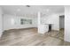 Open-concept area with new kitchen, vinyl plank flooring, and bright living room at 113 W Division St, Winter Garden, FL 34787