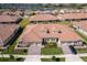 Beautiful aerial view of the property, showcasing lush landscaping and a well-manicured lawn at 1173 Trappers Trail Loop, Champions Gate, FL 33896