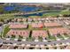 Panoramic aerial shot showcases the community's well-maintained lawns and picturesque landscaping at 1173 Trappers Trail Loop, Champions Gate, FL 33896