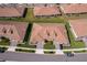 Stunning aerial view of the property showcasing its well-manicured lawn and lush landscaping at 1173 Trappers Trail Loop, Champions Gate, FL 33896