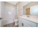 Clean bathroom featuring a shower, tub, and white vanity with gray countertop at 1173 Trappers Trail Loop, Champions Gate, FL 33896